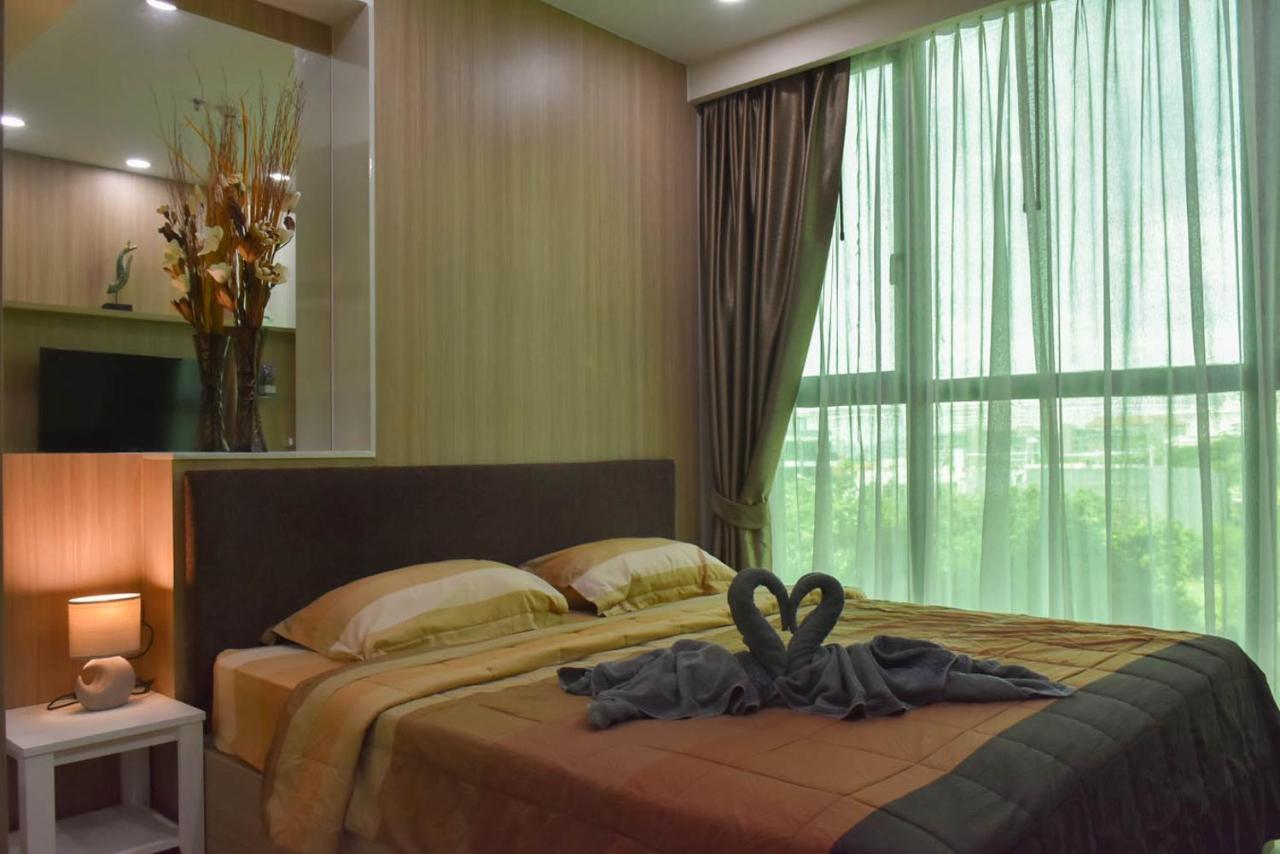 Dusit Grand Condo View Джомтиен Бийч Стая снимка